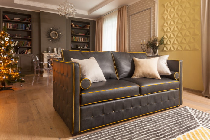 Черный диван с оранжевой строчкой