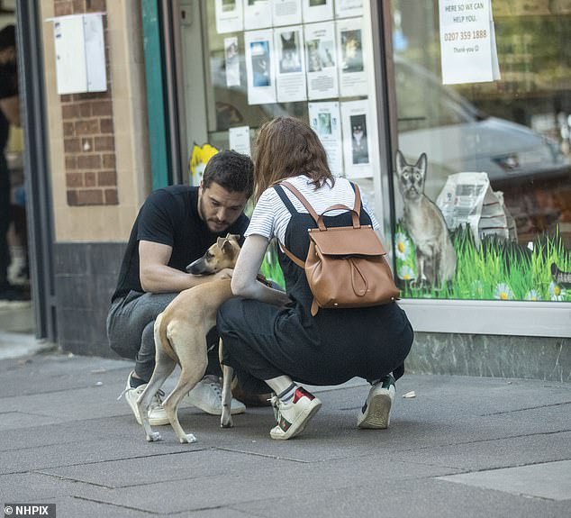 Couple: He was seen out and about with his wife Rose Leslie, 33, and their dog, as they took a stroll in North London