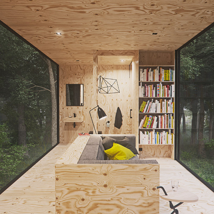 Интерьер маленького домика Tomek Michalski Cabin в лесу