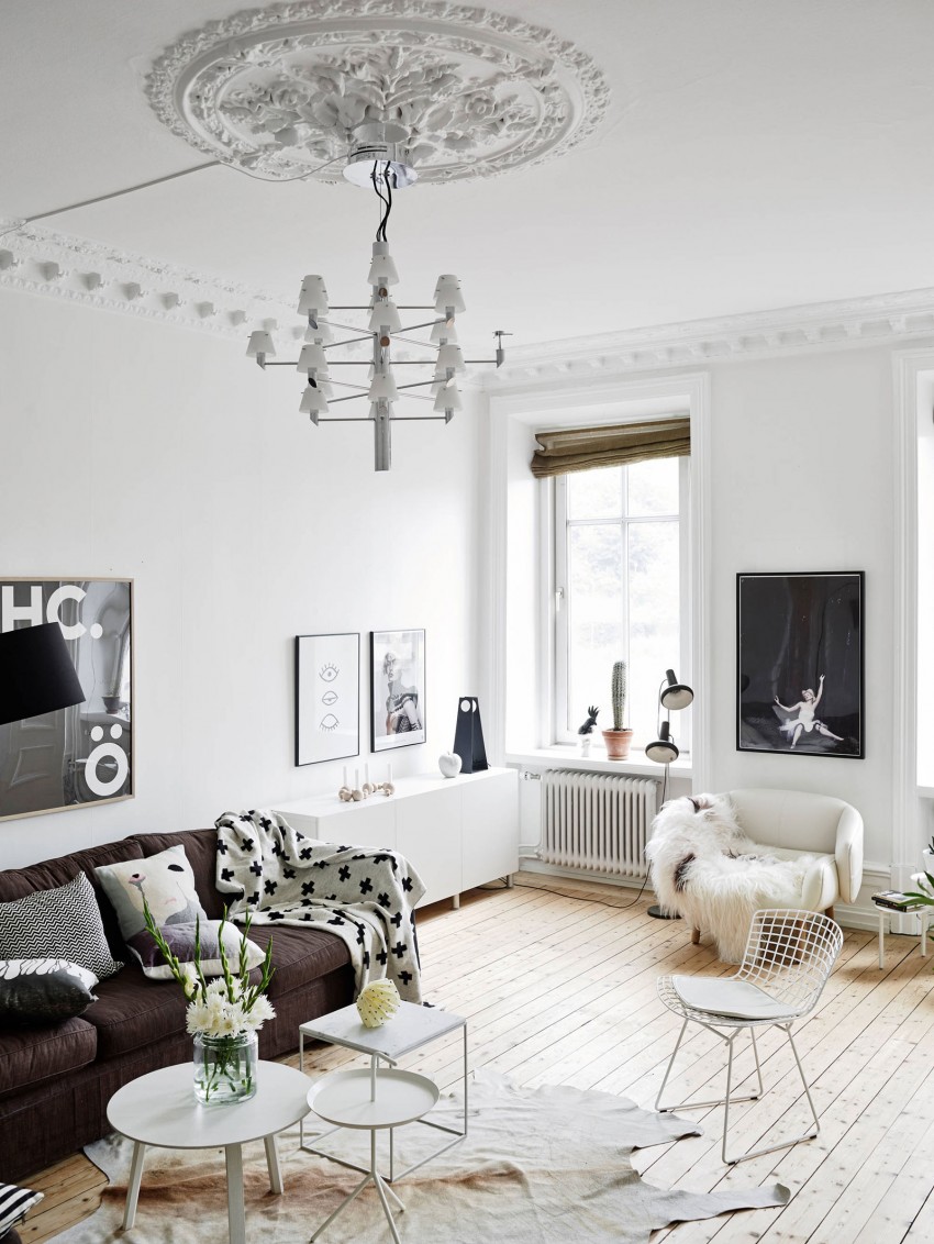 Дизайн подвесного потолочного светильника с обрамлением декоративной лепниной  в интерьере квартиры в скандинавском стиле