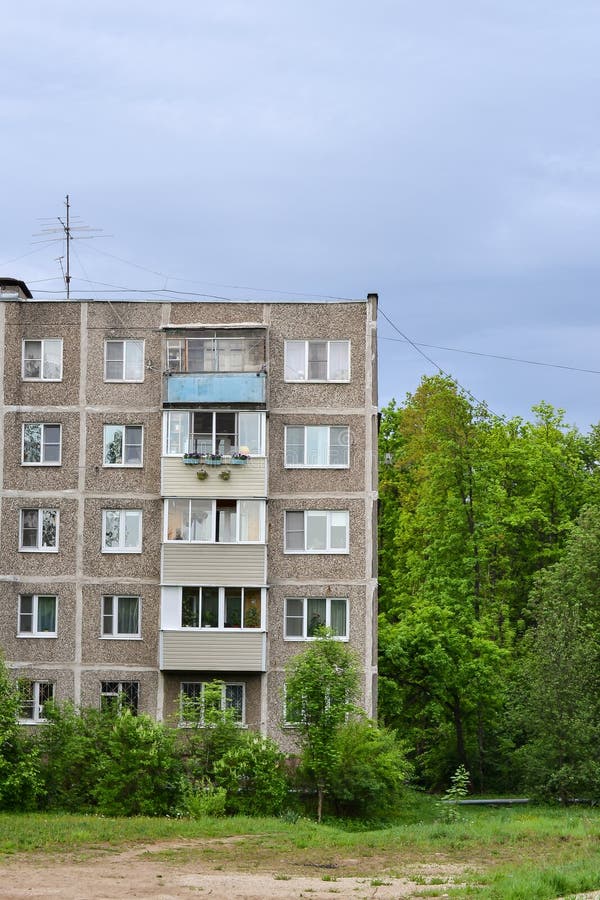 Detail of old five-story building on the outskirts in a residential area. Cheap accommodation built during the Khrushchev and Brez royalty free stock photography