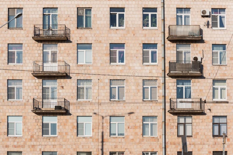 Old residential building exterior, full frame. Soviet multistorey house of Khrushchev time royalty free stock images