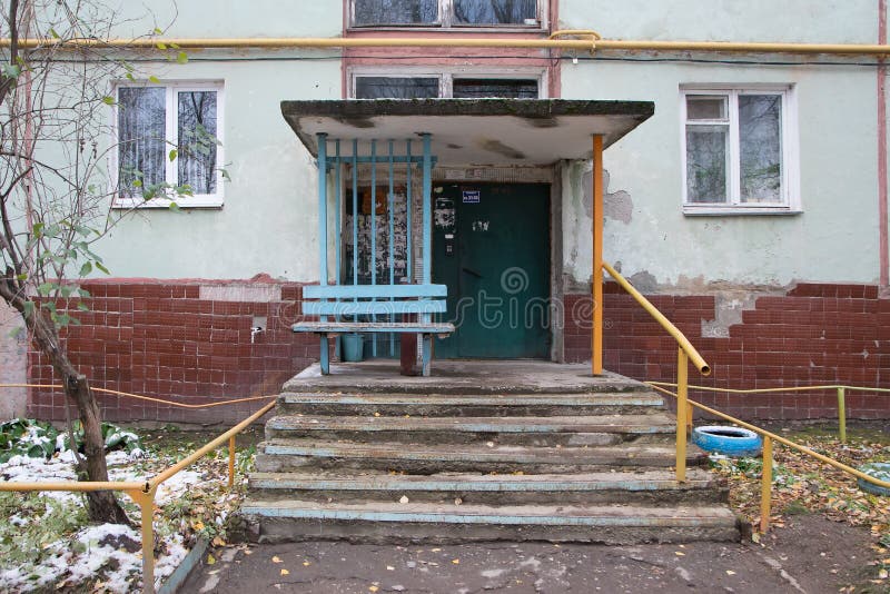 Typical entrance to a multi-apartment old house stock images