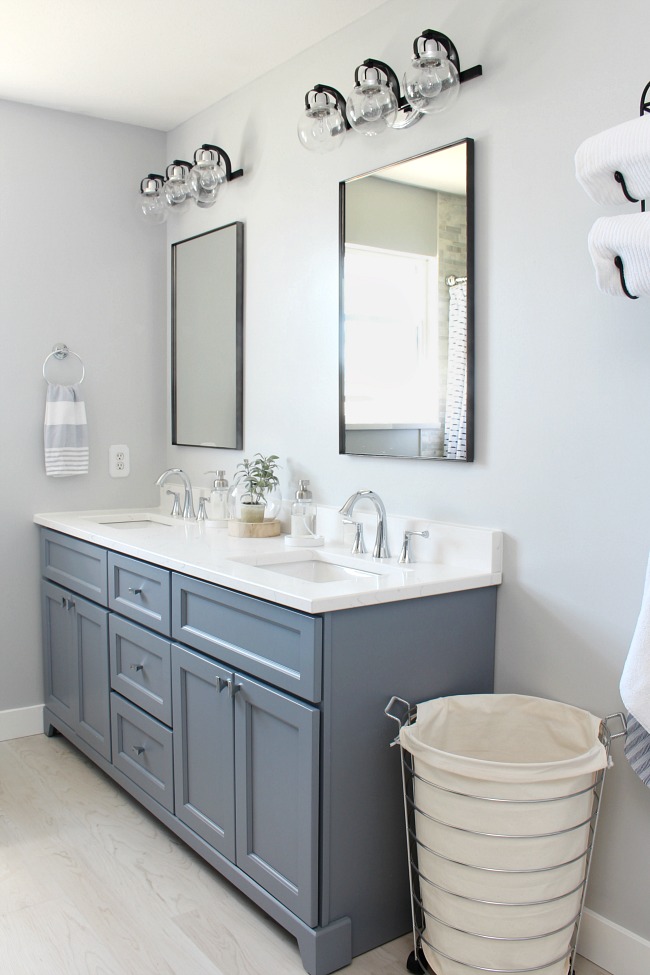 Coastal style bathroom with double vanity.