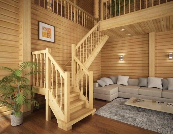 Деревянная лестница из сосны в интерьере гостиной частного дома