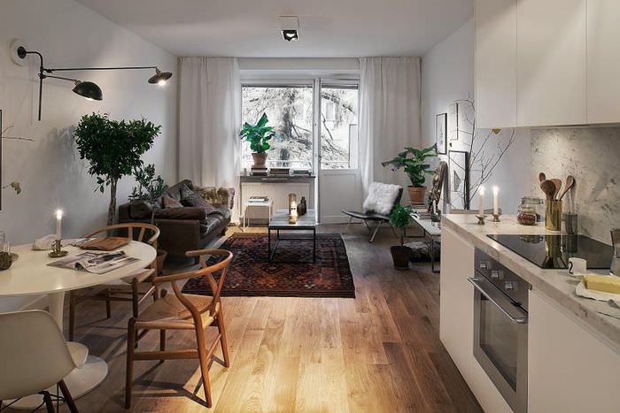 Кухня-гостиная в скандинавском стиле с балконом